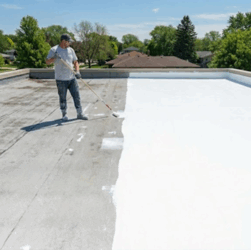 Liquid rubber roof coating applied on flat residential roof