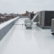 Emergency roof repair fixing a leaking roof during winter weather with EPDM coatings