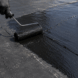 EPDM roof repair using liquid rubber roof coating to stop roof leaks and seal damaged roofing membranes